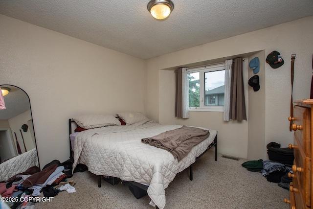 1701 Russian Jack Dr # D3, Anchorage, AK 99508 - carpeted bedroom with a textured ceiling