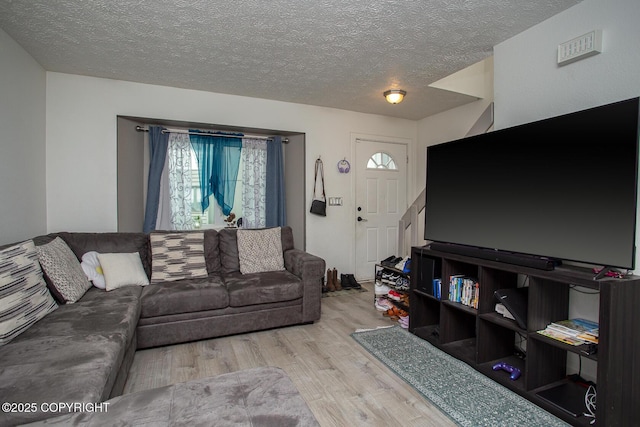 1701 Russian Jack Dr # D3, Anchorage, AK 99508 - living area featuring wood finished floors and a textured ceiling