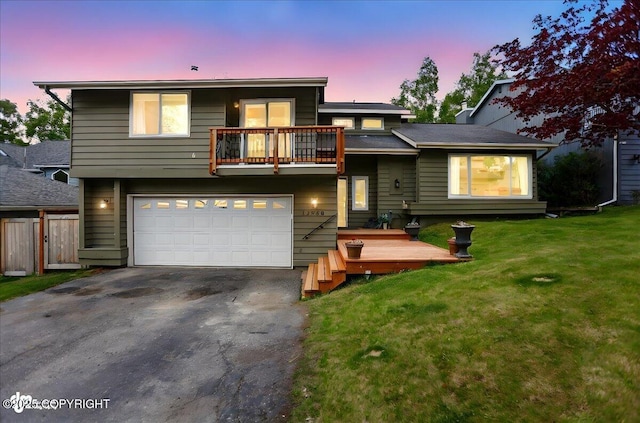 12900 Wellsford Cir, Anchorage, AK 99516 - view of front of home featuring a balcony, asphalt driveway, and a garage