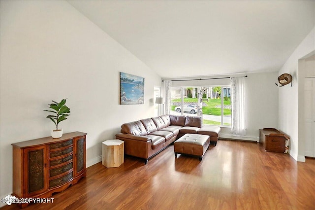 12900 Wellsford Cir, Anchorage, AK 99516 - living area featuring lofted ceiling, wood finished floors, baseboard heating, and baseboards