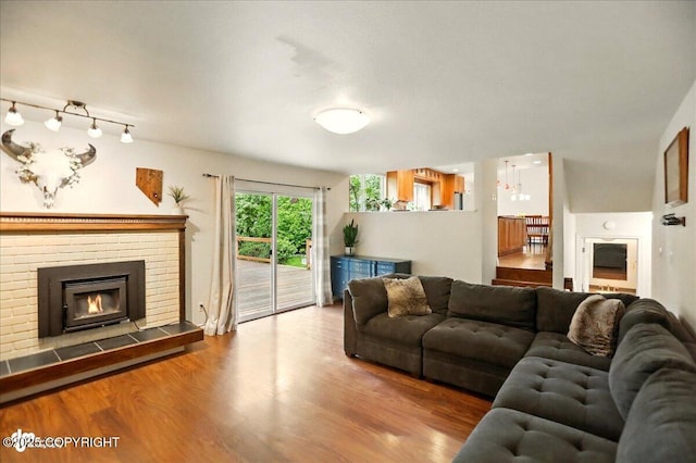 12900 Wellsford Cir, Anchorage, AK 99516 - living room with a brick fireplace and wood finished floors