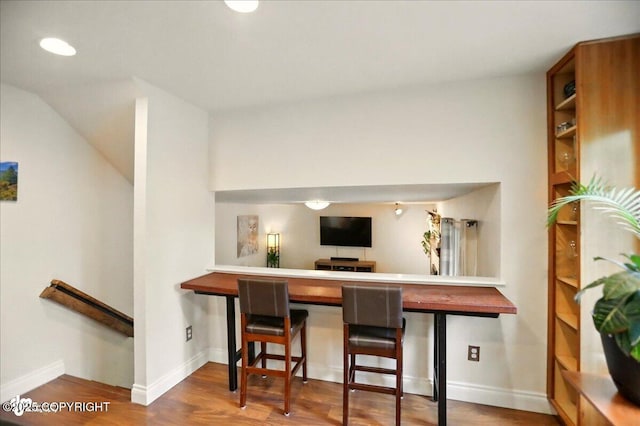 12900 Wellsford Cir, Anchorage, AK 99516 - bar area with wood finished floors, baseboards, and lofted ceiling