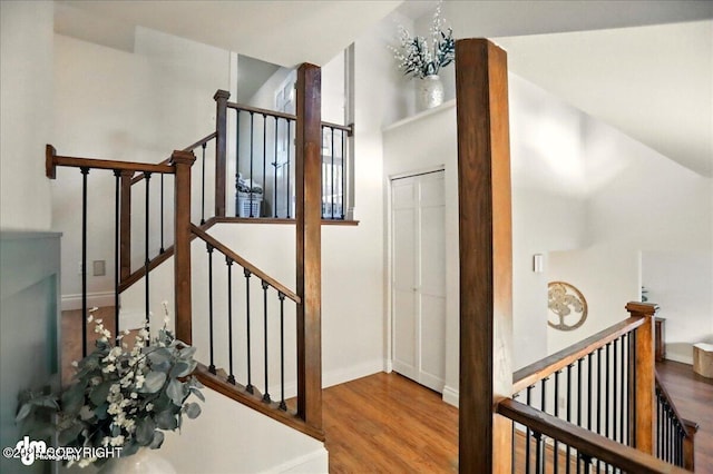 12900 Wellsford Cir, Anchorage, AK 99516 - stairs with wood finished floors, baseboards, and a chandelier