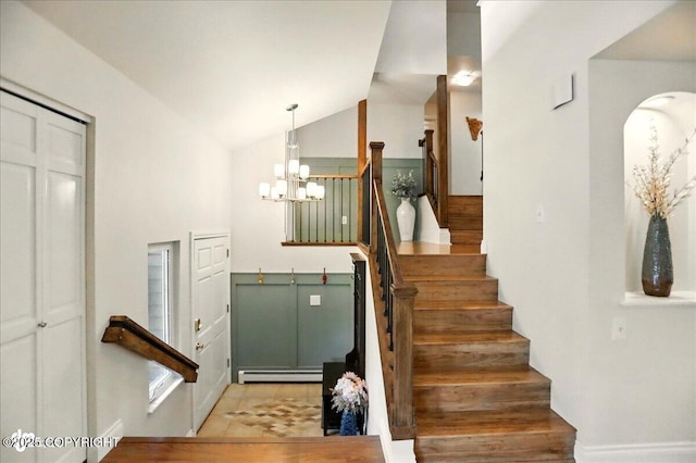 12900 Wellsford Cir, Anchorage, AK 99516 - stairs with a baseboard radiator, lofted ceiling, and a chandelier
