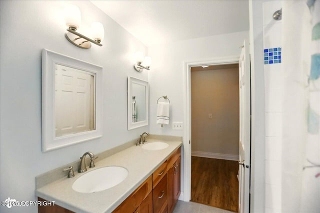 12900 Wellsford Cir, Anchorage, AK 99516 - full bath with double vanity and wood finished floors