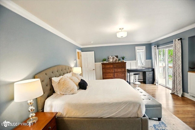 12900 Wellsford Cir, Anchorage, AK 99516 - bedroom with access to outside, wood finished floors, ornamental molding, and baseboards