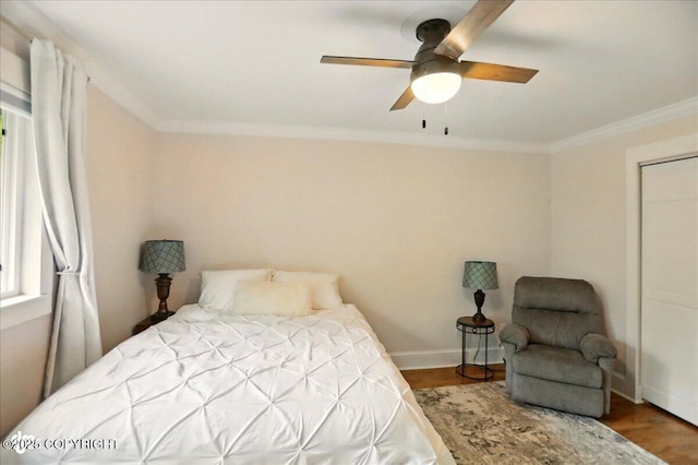 12900 Wellsford Cir, Anchorage, AK 99516 - bedroom featuring ornamental molding, baseboards, wood finished floors, and a ceiling fan