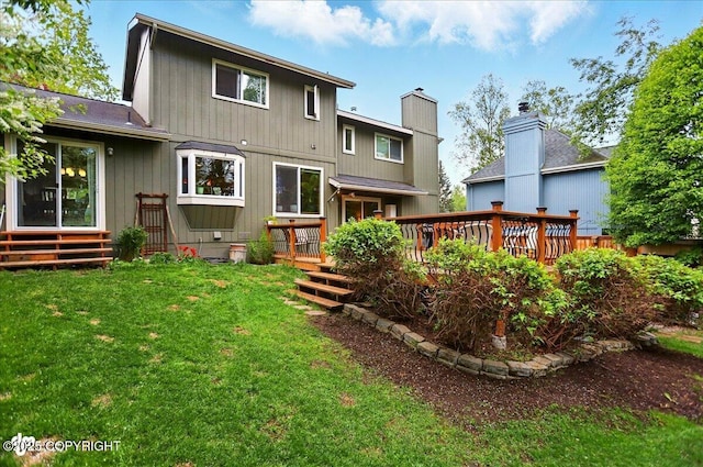 12900 Wellsford Cir, Anchorage, AK 99516 - rear view of house with a deck and a yard