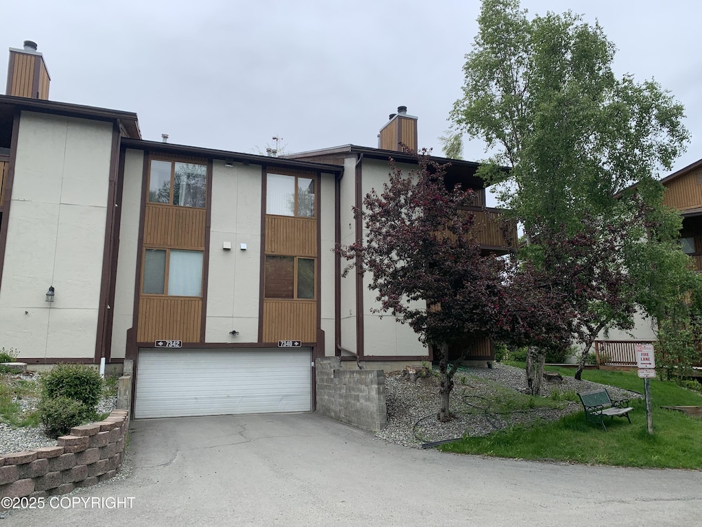 7340 Huntsmen Cir # G, Anchorage, AK 99518 - view of front of property featuring a chimney