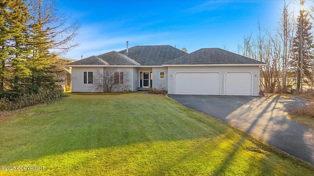 674 W Selina Ln, Wasilla, AK 99654 - view of front of house with driveway, a garage, and a front yard