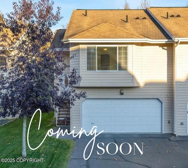 11437 Spyglass Hill Cir, Anchorage, AK 99515 - view of front of house with a garage, roof with shingles, and driveway