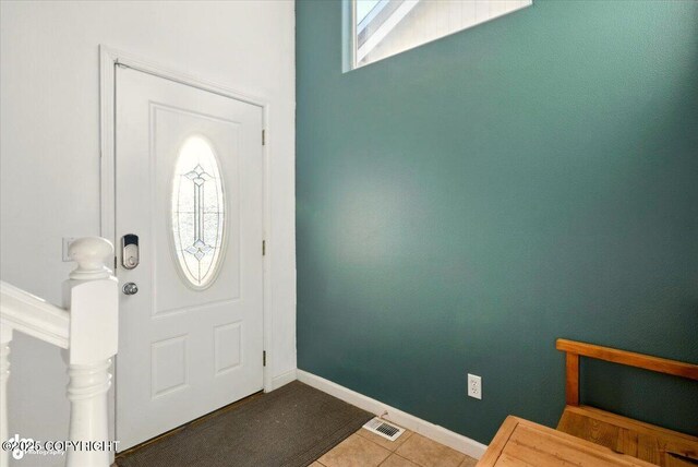 11437 Spyglass Hill Cir, Anchorage, AK 99515 - foyer featuring tile patterned flooring and baseboards