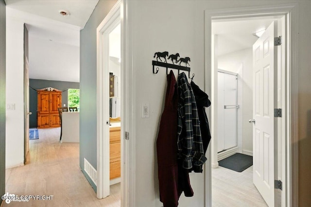 11437 Spyglass Hill Cir, Anchorage, AK 99515 - corridor with light wood finished floors