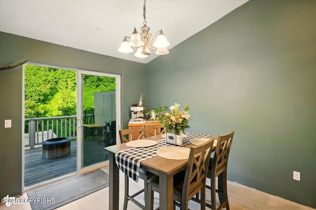 11437 Spyglass Hill Cir, Anchorage, AK 99515 - dining area featuring a chandelier, light wood-type flooring, and lofted ceiling