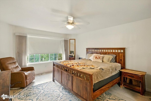 11437 Spyglass Hill Cir, Anchorage, AK 99515 - bedroom with light wood-type flooring and ceiling fan