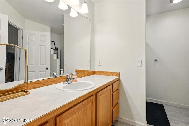 11437 Spyglass Hill Cir, Anchorage, AK 99515 - bathroom with vanity and wood finished floors