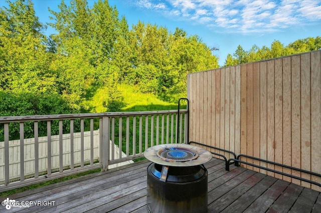 11437 Spyglass Hill Cir, Anchorage, AK 99515 - wooden deck with a fire pit
