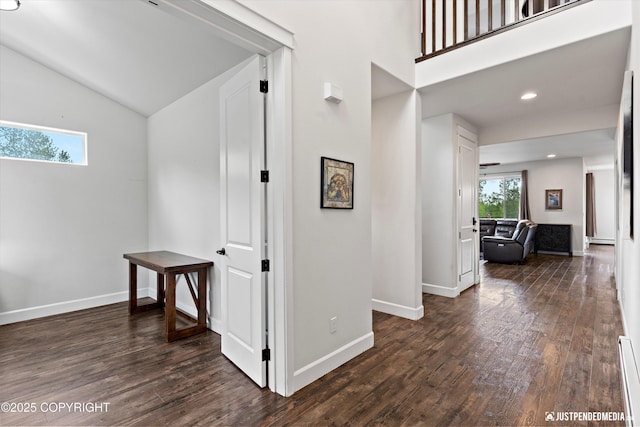 1506 M St, Anchorage, AK 99501 - hall featuring dark wood-style flooring, lofted ceiling, baseboard heating, baseboards, and recessed lighting