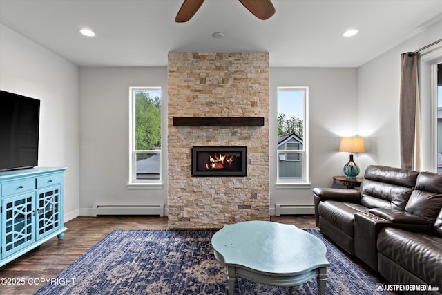 1506 M St, Anchorage, AK 99501 - living area with a baseboard heating unit, baseboard heating, ceiling fan, wood finished floors, and baseboards