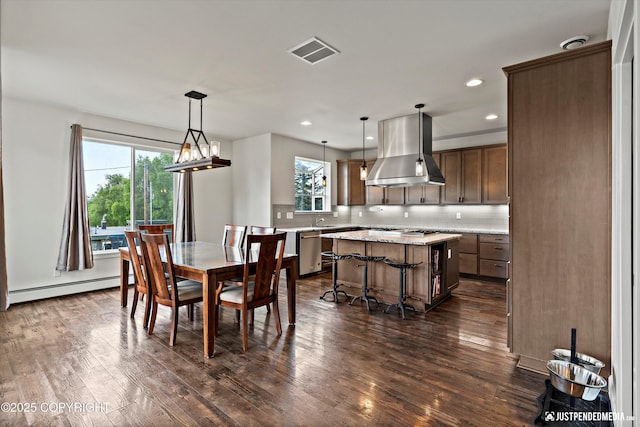 1506 M St, Anchorage, AK 99501 - dining area featuring a baseboard heating unit, plenty of natural light, dark wood-style floors, and recessed lighting