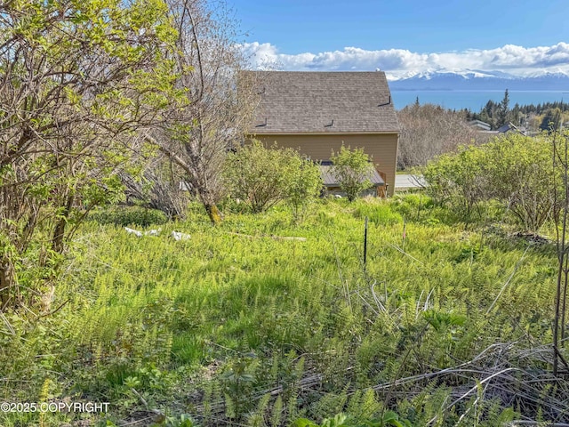 124 Mountain View Dr, Homer, AK 99603 - view of side of property with a shingled roof
