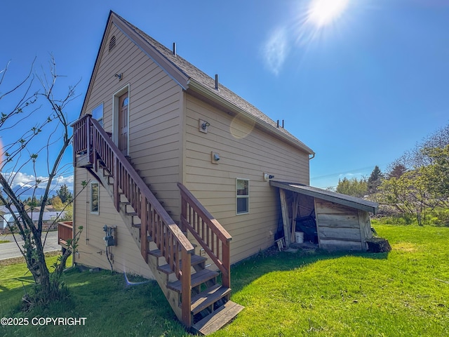 124 Mountain View Dr, Homer, AK 99603 - back of house with stairway and a yard
