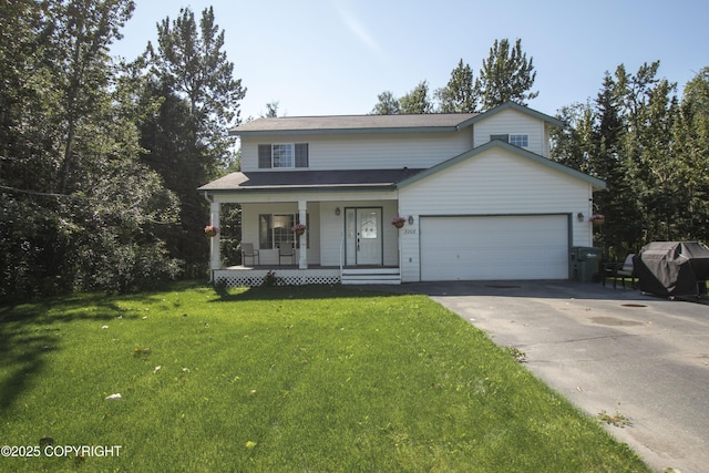 3208 E Serendipity Loop, Wasilla, AK 99654 - traditional home with a porch, driveway, a garage, and a front lawn