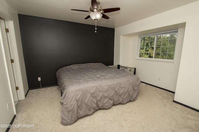 3208 E Serendipity Loop, Wasilla, AK 99654 - carpeted bedroom featuring baseboards and a ceiling fan
