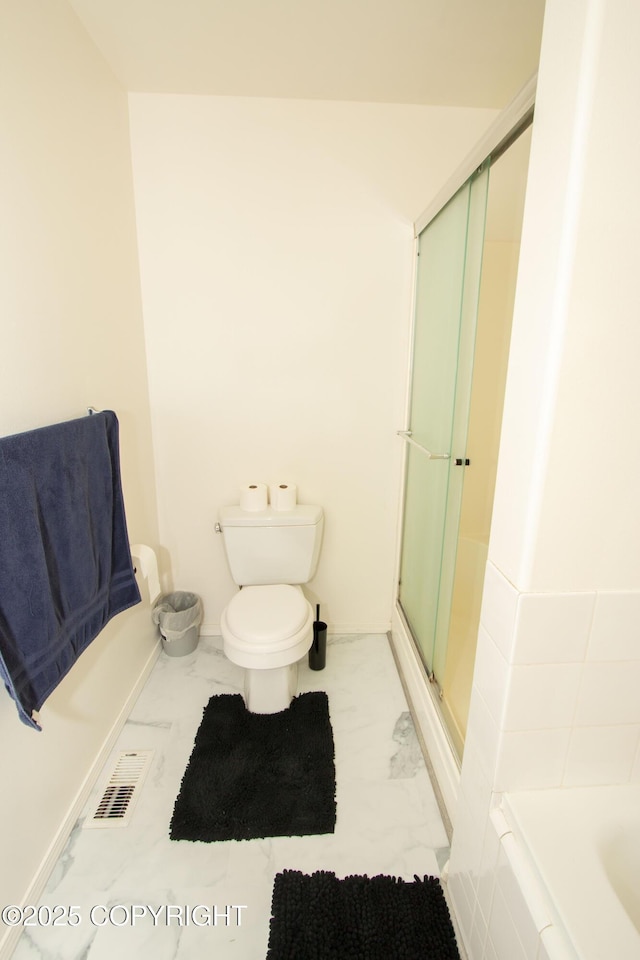 3208 E Serendipity Loop, Wasilla, AK 99654 - bathroom featuring marble finish floors, toilet, a bathtub, and a stall shower