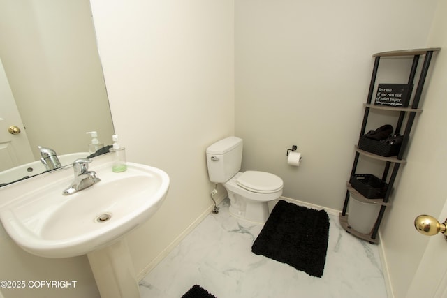 3208 E Serendipity Loop, Wasilla, AK 99654 - bathroom with marble finish flooring, baseboards, toilet, and a sink