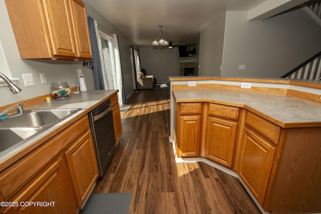 3208 E Serendipity Loop, Wasilla, AK 99654 - kitchen with stainless steel dishwasher, dark wood-style flooring, a chandelier, a sink, and brown cabinets