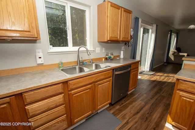 3208 E Serendipity Loop, Wasilla, AK 99654 - kitchen with dishwasher, a sink, dark wood-type flooring, light countertops, and brown cabinetry