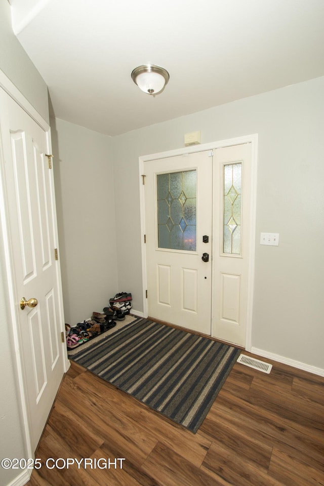 3208 E Serendipity Loop, Wasilla, AK 99654 - foyer featuring wood finished floors and baseboards