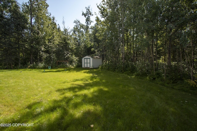 3208 E Serendipity Loop, Wasilla, AK 99654 - view of grassy yard featuring a wooded view