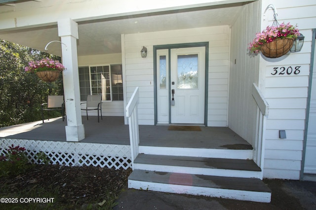 3208 E Serendipity Loop, Wasilla, AK 99654 - property entrance featuring a porch