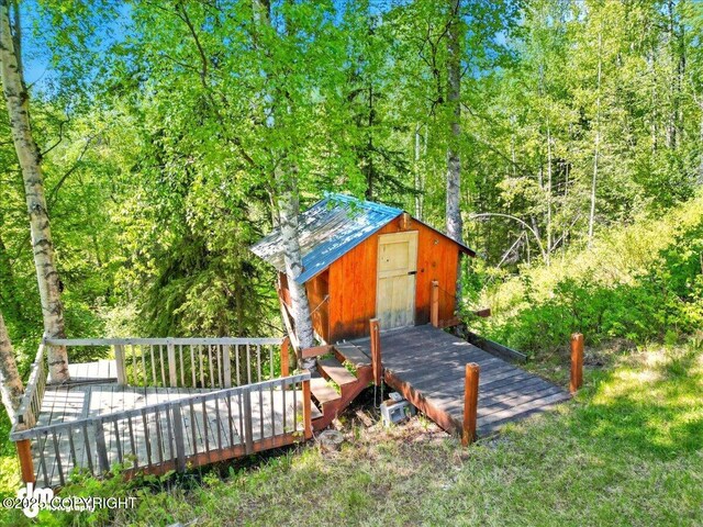 5680 W Birch Harbor Dr, Wasilla, AK 99623 - view of shed featuring a wooded view
