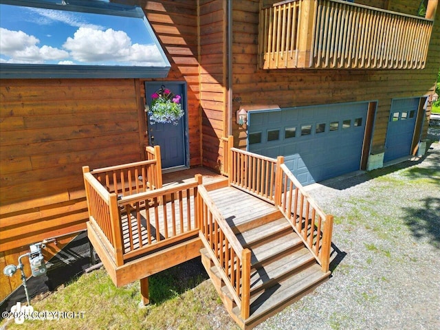 5680 W Birch Harbor Dr, Wasilla, AK 99623 - wooden deck with a garage and driveway
