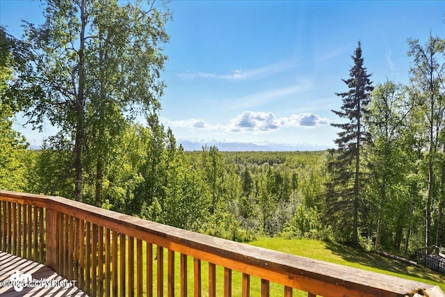 5680 W Birch Harbor Dr, Wasilla, AK 99623 - wooden deck with a view of trees and a lawn