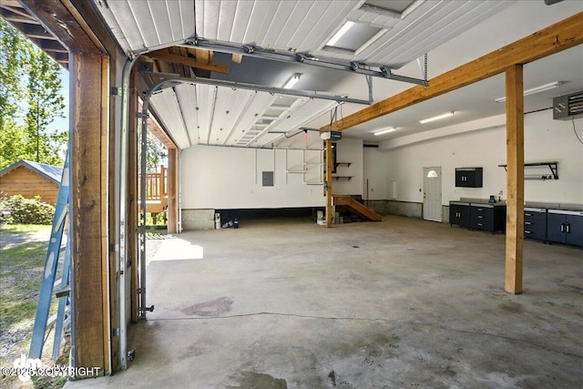 5680 W Birch Harbor Dr, Wasilla, AK 99623 - garage with a garage door opener, electric panel, and a heating unit
