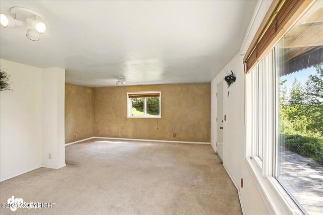 5680 W Birch Harbor Dr, Wasilla, AK 99623 - spare room featuring light carpet and baseboards