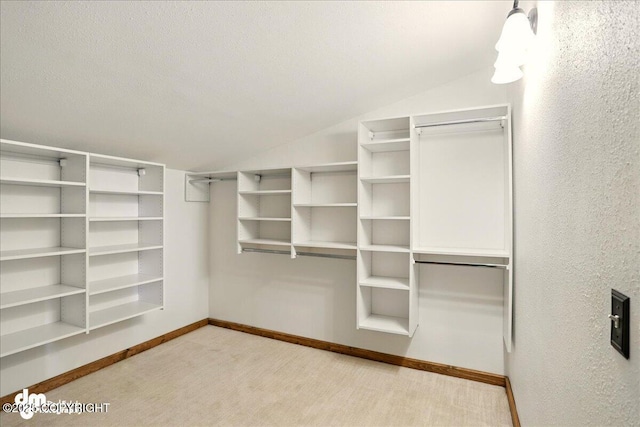 5680 W Birch Harbor Dr, Wasilla, AK 99623 - walk in closet with vaulted ceiling and carpet flooring