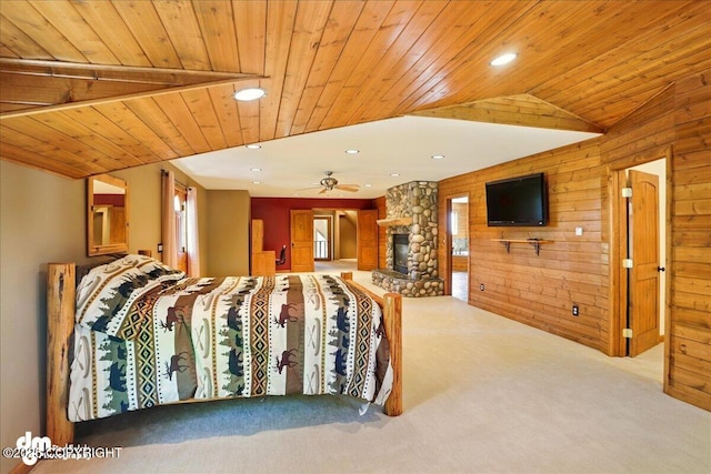 5680 W Birch Harbor Dr, Wasilla, AK 99623 - bedroom featuring carpet flooring, wood ceiling, wood walls, multiple windows, and a stone fireplace