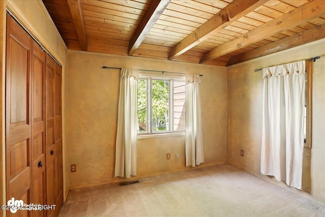 5680 W Birch Harbor Dr, Wasilla, AK 99623 - empty room featuring light carpet and wooden ceiling with exposed beams