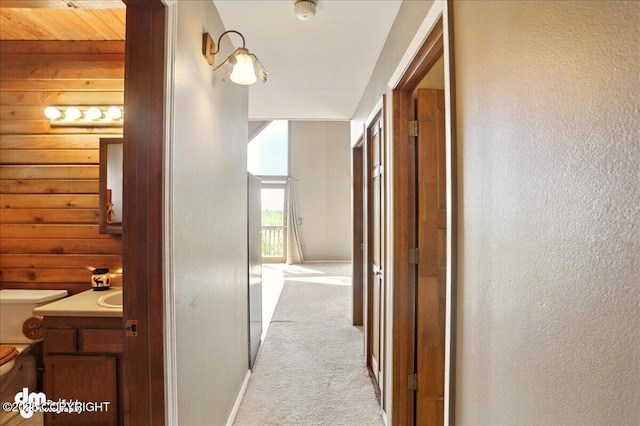 5680 W Birch Harbor Dr, Wasilla, AK 99623 - corridor with light carpet and baseboards