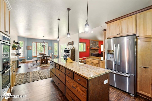 6325 S Hayfield Rd, Wasilla, AK 99654 - kitchen featuring stainless steel appliances, plenty of natural light, dark wood-type flooring, and a center island