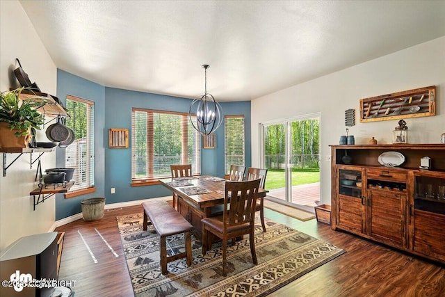 6325 S Hayfield Rd, Wasilla, AK 99654 - dining room featuring a chandelier, wood finished floors, plenty of natural light, and baseboards