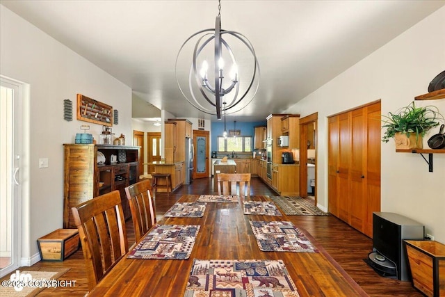 6325 S Hayfield Rd, Wasilla, AK 99654 - dining area with a chandelier and dark wood-style floors