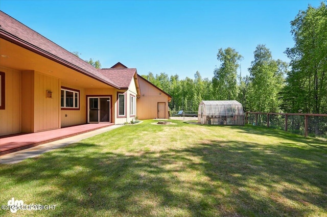 6325 S Hayfield Rd, Wasilla, AK 99654 - view of yard with a greenhouse and an outbuilding