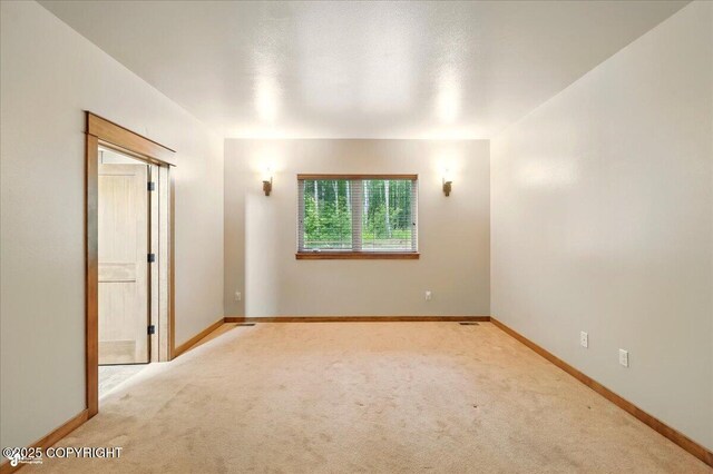 6325 S Hayfield Rd, Wasilla, AK 99654 - carpeted empty room featuring baseboards