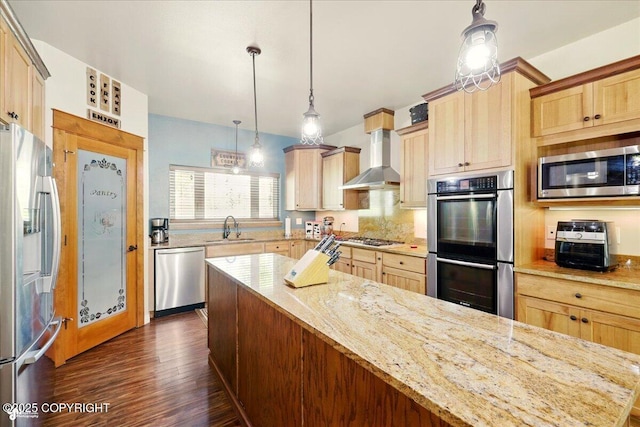 6325 S Hayfield Rd, Wasilla, AK 99654 - kitchen featuring stainless steel appliances, a sink, dark wood-style flooring, light stone counters, and wall chimney exhaust hood